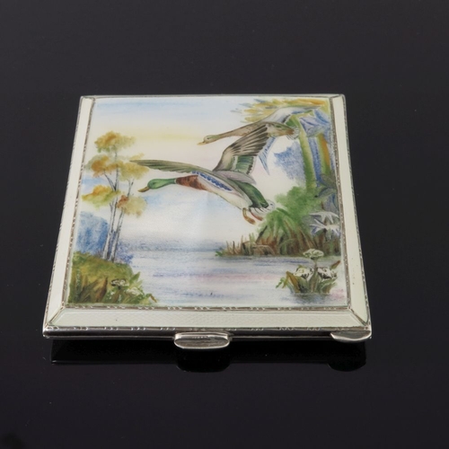 203 - A George VI silver square powder compact, the cover enamelled with Mallard in flight, maker Henry Cl... 