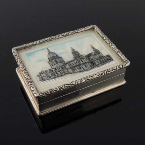 204 - An Elizabeth II silver rectangular pill box, the cover enamelled with a view of St Paul's Cathedral,... 