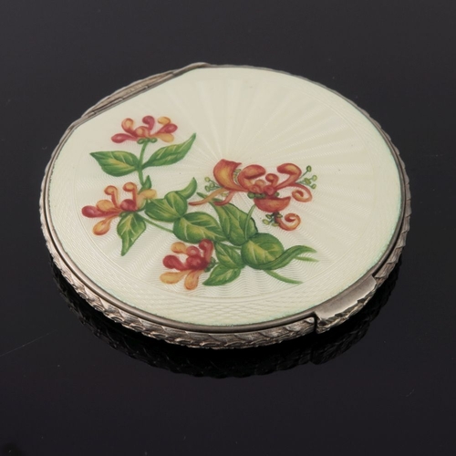 205 - Three silver circular powder compacts, in cream guilloche enamel and painted with various flowers, a... 