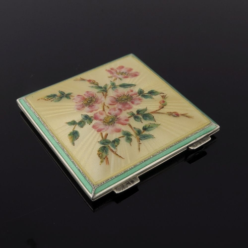 209 - A silver octagonal powder compact in cream guilloche enamel with painted cornflowers, a circular cre... 