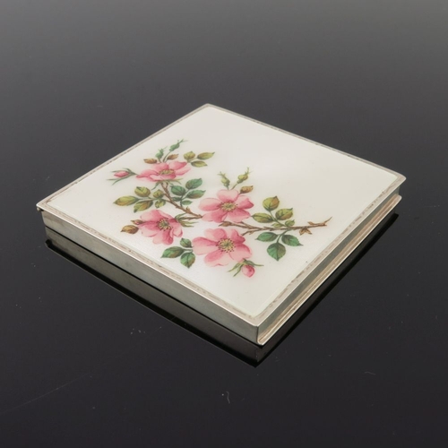 211 - A George VI silver enamel square powder compact, the cover with apple blossom on a cream guilloche g... 