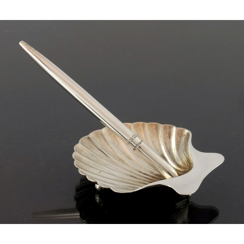 212 - Tiffany and Co., a silver pen stand and ballpoint pen, modelled as a scallop shell, with tapered pen... 