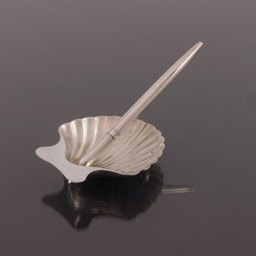 212 - Tiffany and Co., a silver pen stand and ballpoint pen, modelled as a scallop shell, with tapered pen... 