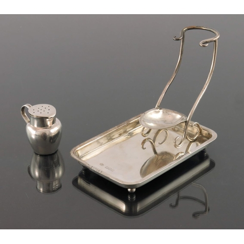 214 - An Edwardian silver pipe stand, George Betjemann and Sons, London 1904, the rectangular tray with sc... 