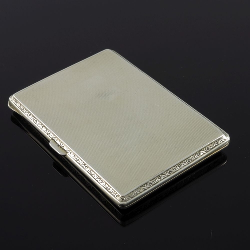 220 - A George V silver cigarette case, the cover enamelled with a scene of figures on a horse and cart an... 