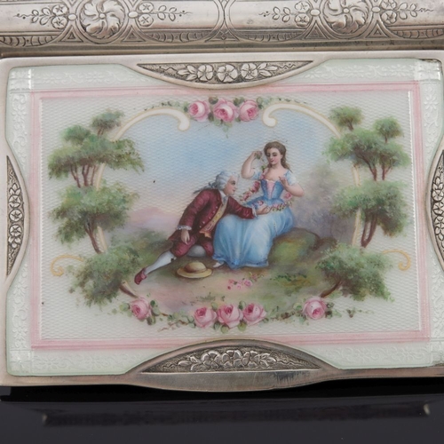 222 - A George V silver snuff box, the cover with enamelled Rococo scene of a courtly couple in a landscap... 