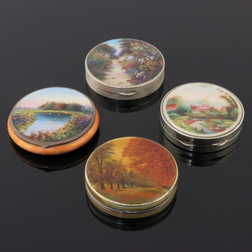 236 - A silver orange guilloche enamel powder compact, the lid with a river landscape, together with three... 