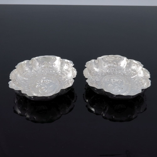 242 - A pair of Edwardian silver dishes, William Comyns, London 1905, lobed oval flower form, with crimped... 