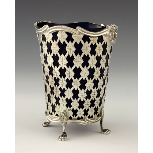 245 - An Edwardian reticulated silver and glass vase, Thomas Bradbury and Sons, Sheffield 1902, the conica... 