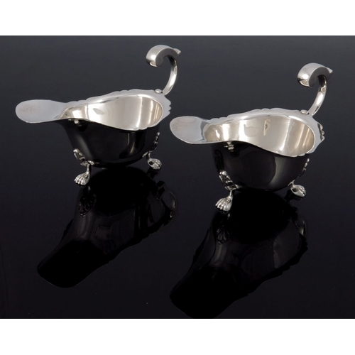 246 - A pair of George V silver sauce boats, William Neale, Birmingham 1932, ogee rimmed helmet form, open... 