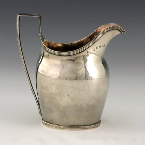 252 - A George III silver cream jug, Crispin Fuller overstruck Samuel Godbehere, London 1795, helmet form ... 