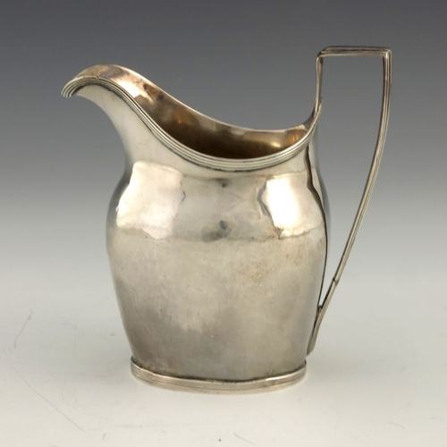 252 - A George III silver cream jug, Crispin Fuller overstruck Samuel Godbehere, London 1795, helmet form ... 