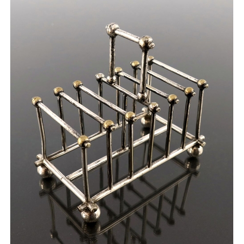 256 - After Christopher Dresser, a silver plated six division toast rack, Goldsmiths and Silversmiths Comp... 