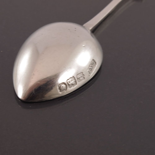 263 - Archibald Knox for Liberty and Co., an Arts and Crafts silver Decos teaspoon, London 1899, cast and ... 