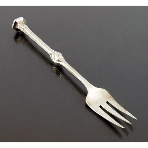 271 - Omar Ramsden and Alwyn Carr, an Arts and Crafts silver pickle fork, London 1913, planished and taper... 