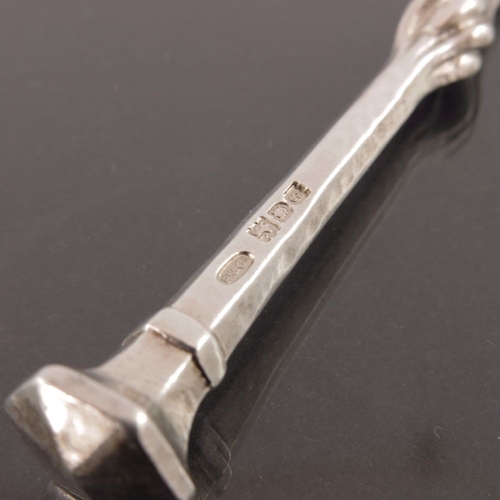 271 - Omar Ramsden and Alwyn Carr, an Arts and Crafts silver pickle fork, London 1913, planished and taper... 