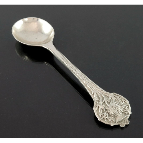 272 - Alwyn Carr, an Arts and Crafts silver spoon, London 1920, planished and cast with a thistle terminal... 