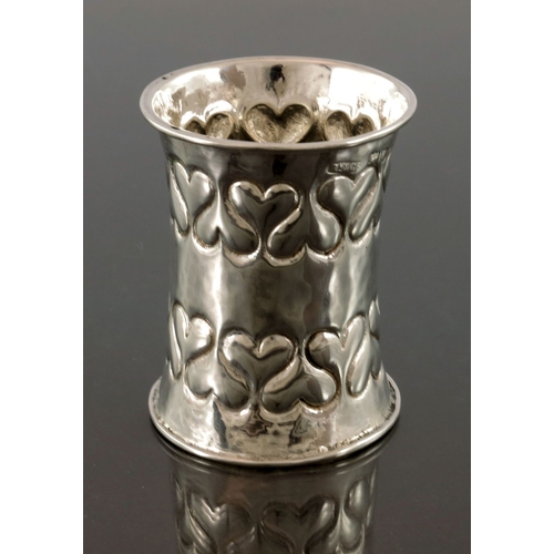 275 - Omar Ramsden and Alwyn Carr, an Arts and Crafts silver napkin ring, London 1899, waisted form, plani... 