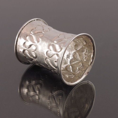 275 - Omar Ramsden and Alwyn Carr, an Arts and Crafts silver napkin ring, London 1899, waisted form, plani... 