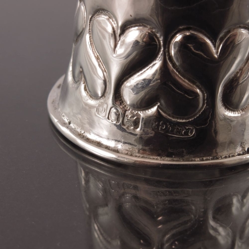 275 - Omar Ramsden and Alwyn Carr, an Arts and Crafts silver napkin ring, London 1899, waisted form, plani... 