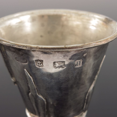 276 - A E Jones, an Arts and Crafts silver mustard pot, Birmingham 1912, flare footed conical form, applie... 