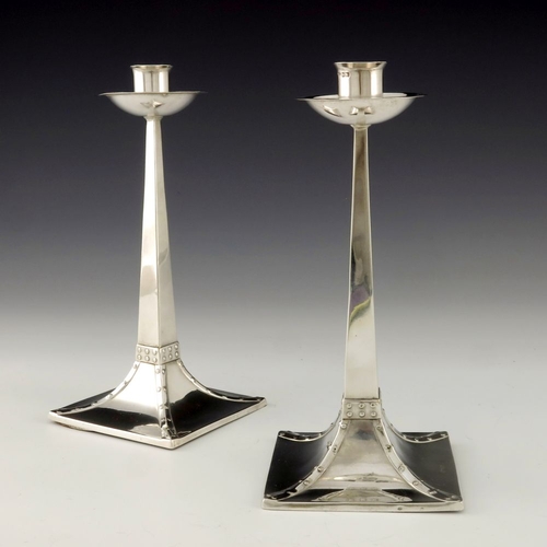 278 - A pair of Arts and Crafts silver candlesticks, after James Dixon and Sons for Mappin and Webb, Sheff... 