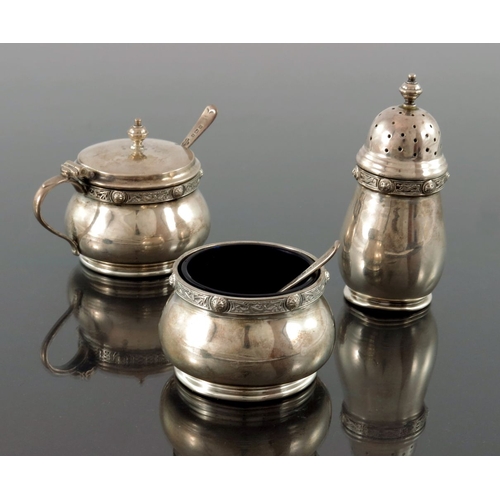 281 - A George VI Iona style three piece silver cruet, Goldsmiths and Silversmiths Company, Birmingham 195... 