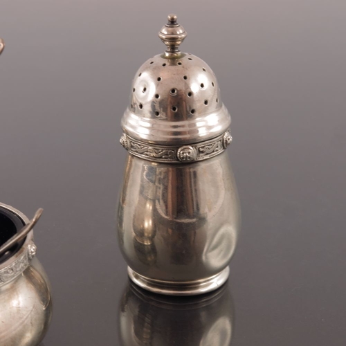 281 - A George VI Iona style three piece silver cruet, Goldsmiths and Silversmiths Company, Birmingham 195... 