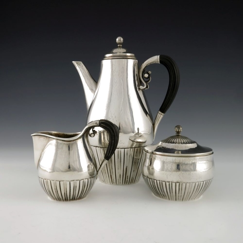 285 - Johan Rohde for Georg Jensen, a Danish silver Cosmos three piece coffee set, model 45, designed circ... 