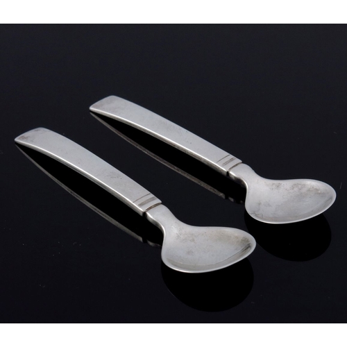 287 - Just Andersen for Georg Jensen, a pair of Danish Art Deco silver Blok Acadia salt spoons, designed 1... 