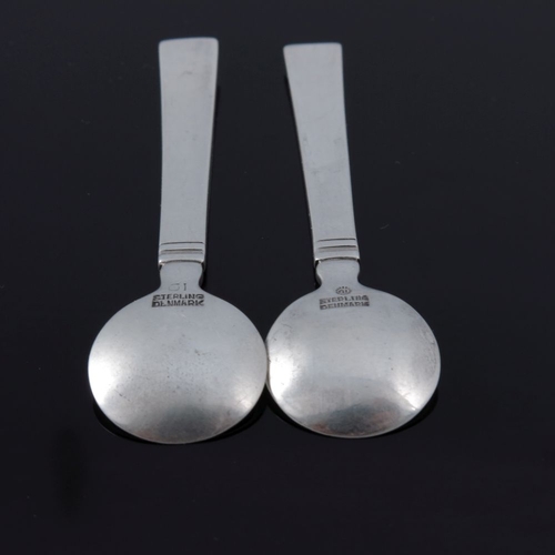 287 - Just Andersen for Georg Jensen, a pair of Danish Art Deco silver Blok Acadia salt spoons, designed 1... 