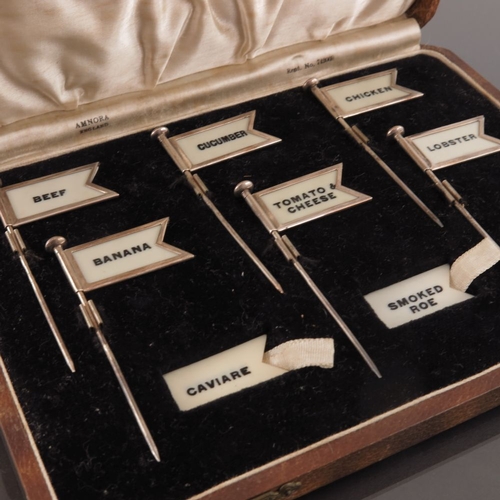 289 - A cased set of Art Deco silver sandwich markers, Adolph Scott, Birmingham 1936, each in the form of ... 