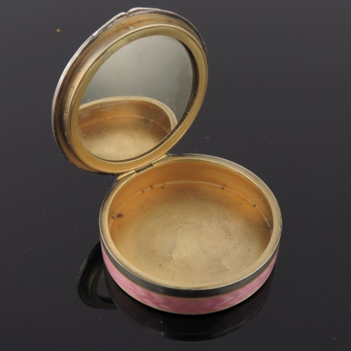 293 - A pink guilloche enamel circular powder compact together with an Art Deco guilloche pink enamel powd... 