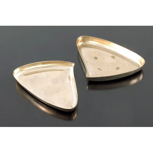 297 - A matched pair of Modernist silver dishes, A E Jones, Birmingham 961 and 1970, triangular teardrop f... 