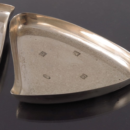 297 - A matched pair of Modernist silver dishes, A E Jones, Birmingham 961 and 1970, triangular teardrop f... 