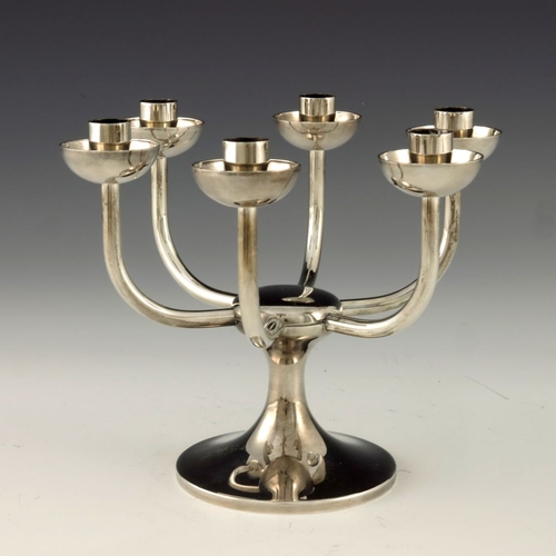 299 - Robert Welch, a Modernist silver six branch candelabrum, London 1984, the capstan type splayed foot ... 