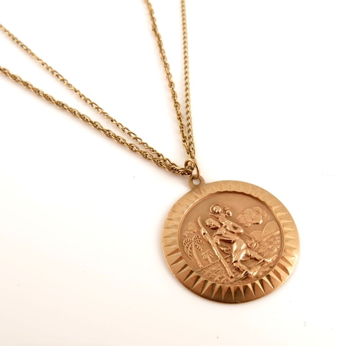 301 - A 9ct gold religious pendant, suspended from two 9ct gold chains, hallmarks for London and Birmingha... 