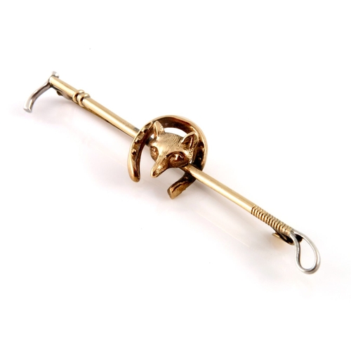 302 - A mid 20th century 9ct gold and silver, fox mask and horseshoe riding crop brooch, with safety chain... 