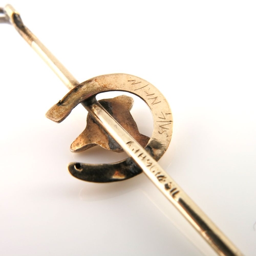 302 - A mid 20th century 9ct gold and silver, fox mask and horseshoe riding crop brooch, with safety chain... 