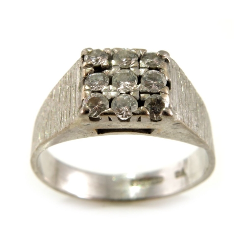 306 - An 18ct gold brilliant-cut diamond cluster dress ring, with textured shoulders and band, estimated t... 