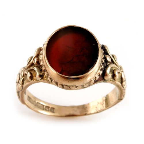 312 - A 1970s 9ct gold orange gem signet ring, with floral engraved shoulders, hallmarks for Birmingham 19... 