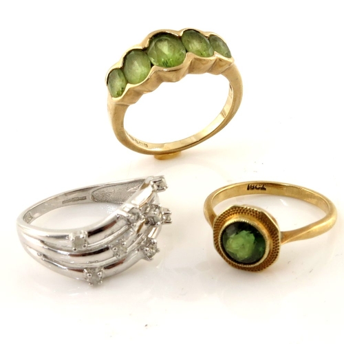 314 - Three gold, peridot and diamond rings, to include an 18ct peridot single-stone ring, a 9ct gold diam... 