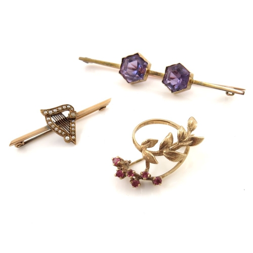 315 - Three gold gem-set brooches, to include a split pearl harp brooch, an amethyst two-stone bar brooch ... 