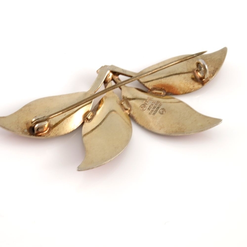 330 - Willy Winnaess for David Andersen, a Danish Modernist silver gilt and enamel four leaf brooch, circa... 