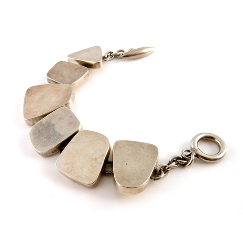 332 - A Modernist silver bracelet, designed as a series of vari-shape polished panels, with toggle clasp, ... 