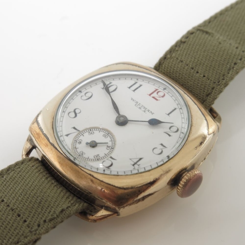 338 - Waltham, a gold plated trench style wrist watch, cushion-shape case, manual wind movement signed Wal... 