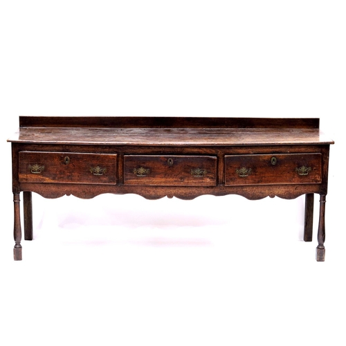 344 - An 18th Century country oak standing dresser, circa 1760, raised back, moulded top, triple frieze dr... 