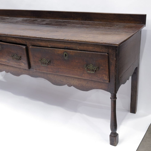 344 - An 18th Century country oak standing dresser, circa 1760, raised back, moulded top, triple frieze dr... 