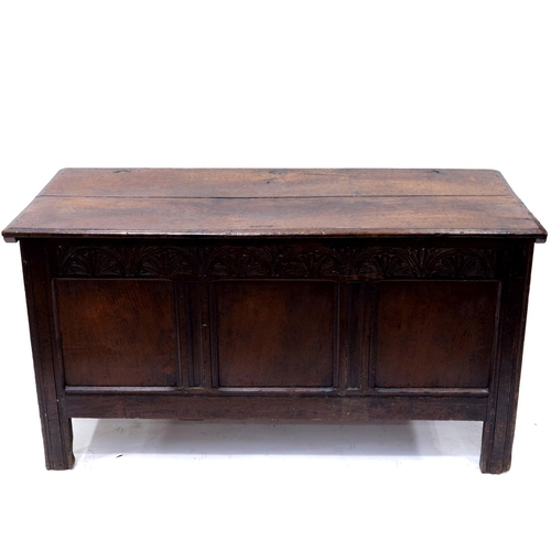 350 - A 17th Century country oak plank chest, circa 1660, moulded and chip carved top and sides with chevr... 