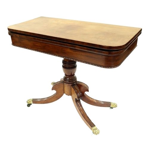 352 - A Regency mahogany pedestal games table, circa 1820, fold-over top with green baize lined surface, b... 